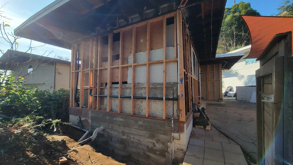 Exterior ADU reconstruction with full wall demo, new framing, and foundation upgrades.