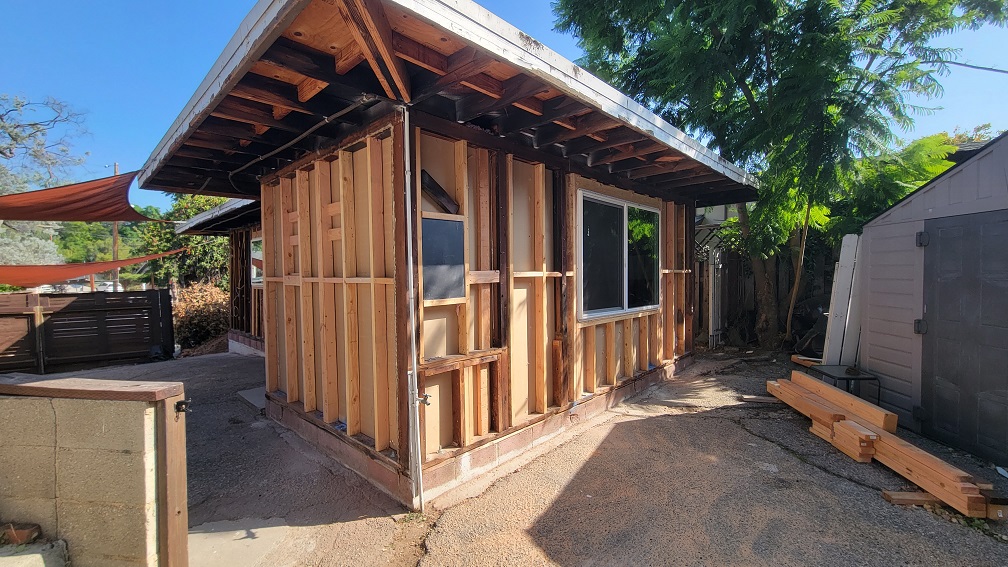 Complete exterior wall framing during ADU rebuild, preparing for sheathing and insulation.