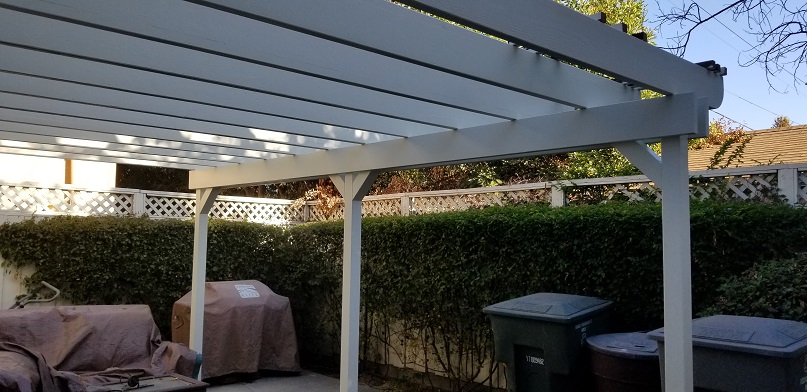 Outdoor patio pergola installation providing shade and upgraded backyard structure.
